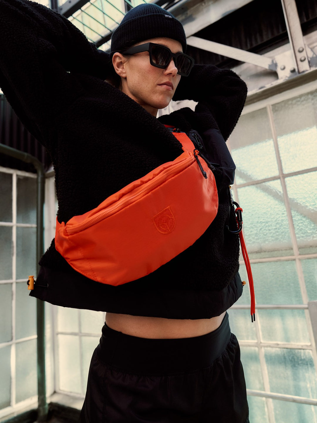 Person wearing a Flame orange Bound bumbag