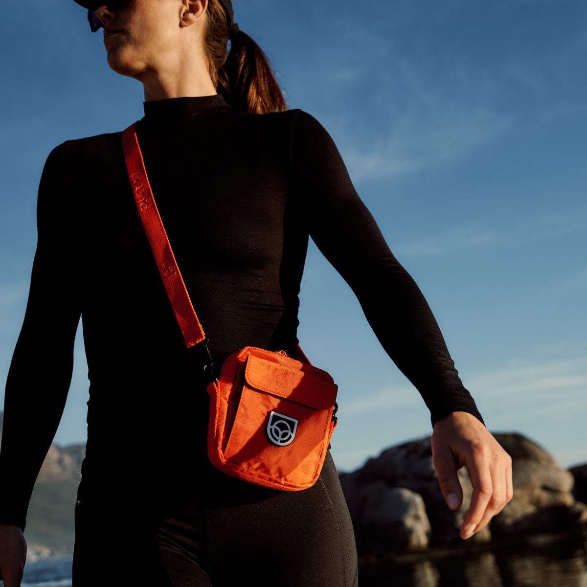 Bound Town Sling Bag in Flame orange – lifestyle