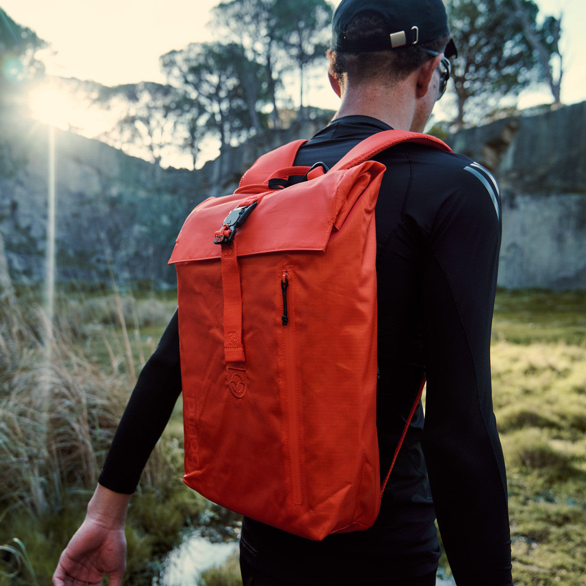 Bound Roll-Top Backpack in Flame orange – lifestyle