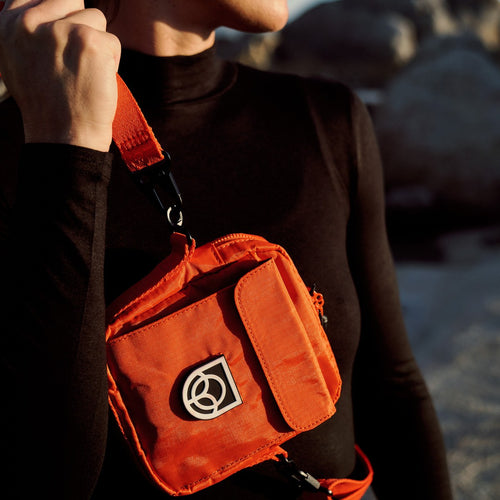 Bound Town Sling Bag in Flame orange – lifestyle