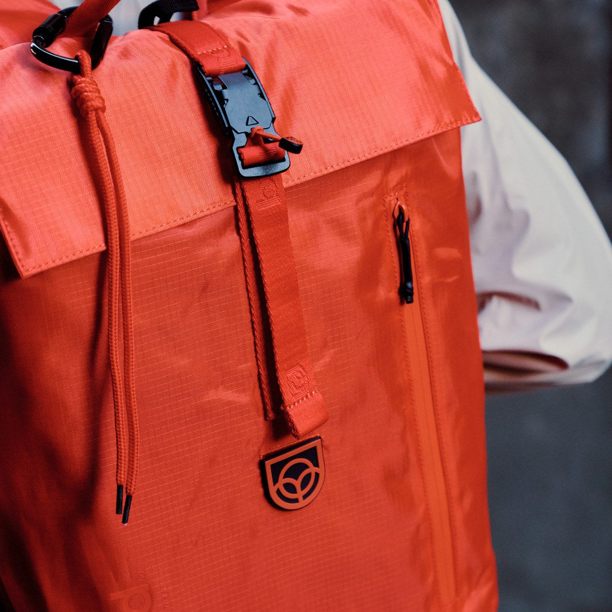 Bound Roll-Top Backpack in Flame orange – lifestyle