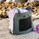 NSRI Tote in green on the beach with a towel and flip-flops beside it