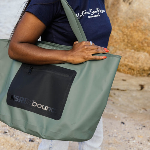 NSRI Tote in green close-up on the shoulder showing the NSRI x bound logo