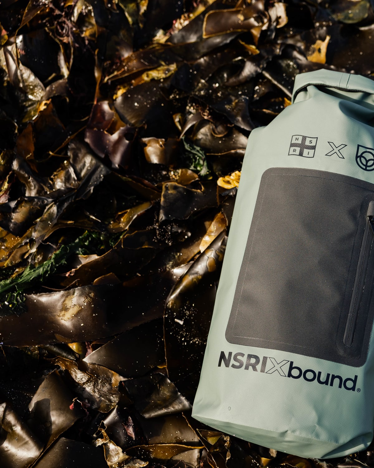 NSRI x Bound waterproof grab bag on kelp, portrait crop for mobile